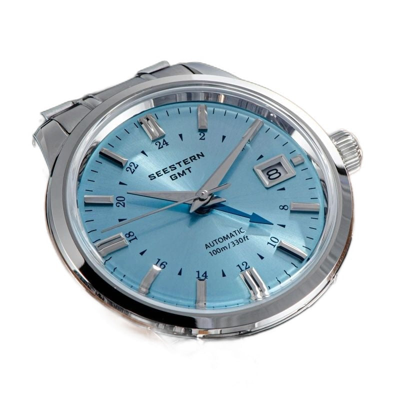 Seestern S446 GMT ice blue dial flatlay showing polished case, crown and date window