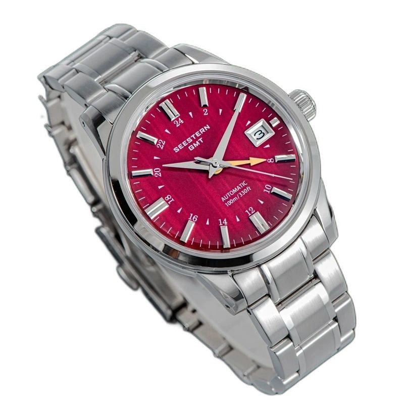 Seestern S446 red-dial GMT on steel bracelet, angled studio product view