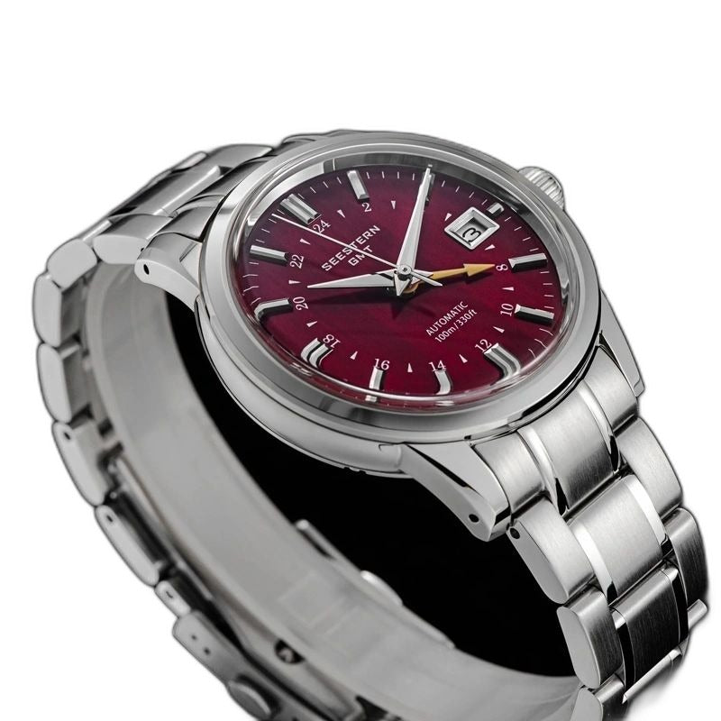 Seestern S446 red-dial GMT on steel bracelet, three-quarter angled view