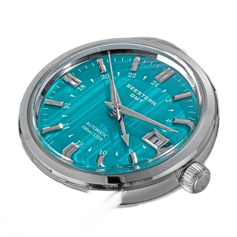 Seestern S446 turquoise green GMT dial flatlay of the watch head with signed crown