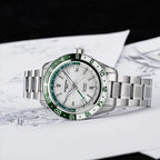 Seestern S456 white MOP-dial GMT with green bezel, flat-lay on designer sketch backdrop