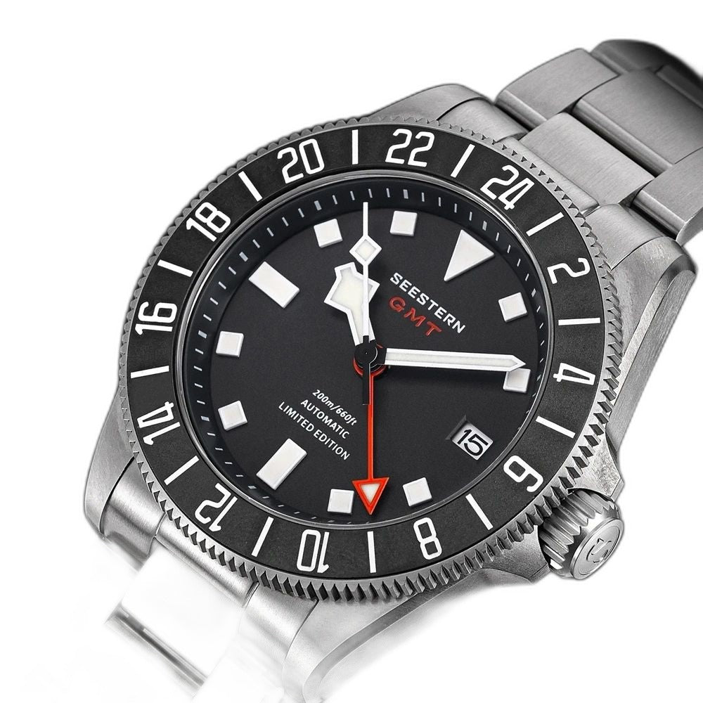 Seestern S462 titanium GMT, black dial, angled studio product view on black background, steel bracelet