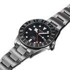 Seestern S462 titanium GMT, black dial, three-quarter angled view on navy leather, steel bracelet