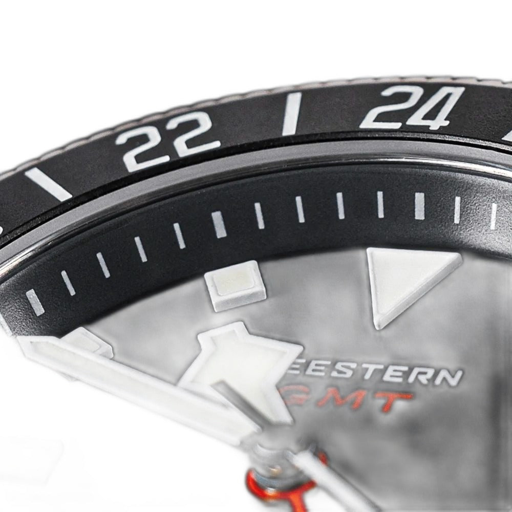 Seestern S462 titanium GMT black dial macro, lume hour markers and white SEESTERN GMT print, close-up