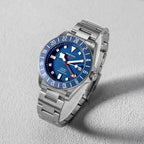 Seestern S462 titanium GMT, blue dial, three-quarter angled view on grey, steel bracelet