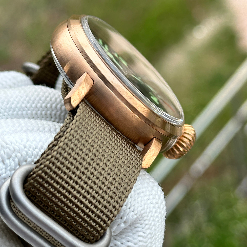Steeldive SD1903S bronze pilot watch domed crystal and case profile from above-side, bezel detail