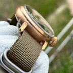 Steeldive SD1903S bronze pilot watch domed crystal and case profile from above-side, bezel detail