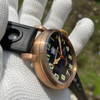 Steeldive SD1903S bronze pilot watch side angle view showing domed crystal, fluted crown and black dial