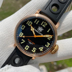 Steeldive SD1903S bronze pilot watch tilted view with rotated dial, C3 green numerals and orange hands