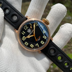 Steeldive SD1903S bronze pilot watch front angle view in gloved hand with black dial and rubber strap