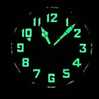 Steeldive SD1903S pilot watch glowing C3 green lume on numerals and hands in darkness, lume shot
