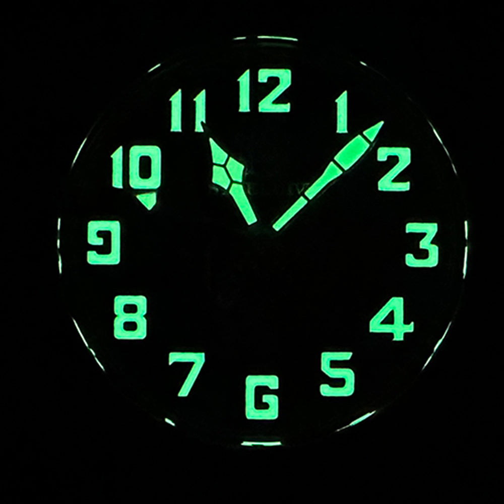 Steeldive SD1903S pilot watch glowing C3 green lume on numerals and hands in darkness, lume shot