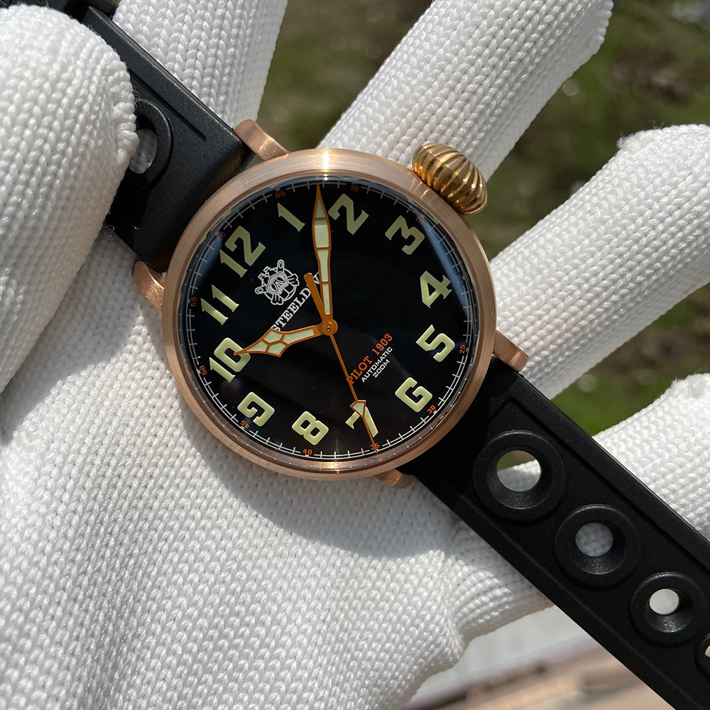 Steeldive SD1903S bronze pilot watch three-quarter view with sunlit bronze case, black dial and onion crown