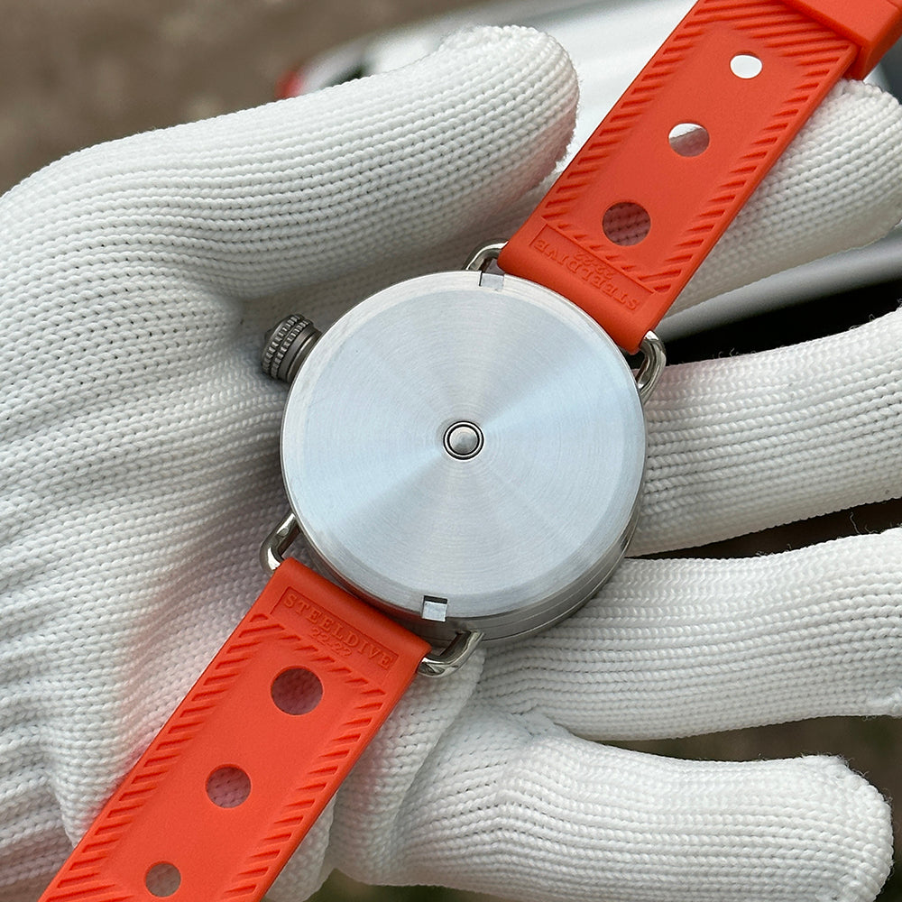 Steeldive SD1912 caseback view, polished 3000m dive watch caseback with Steeldive engraving on orange strap