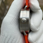 Steeldive SD1912 side profile showing brushed 47mm case flank, screw-down crown and orange rubber strap