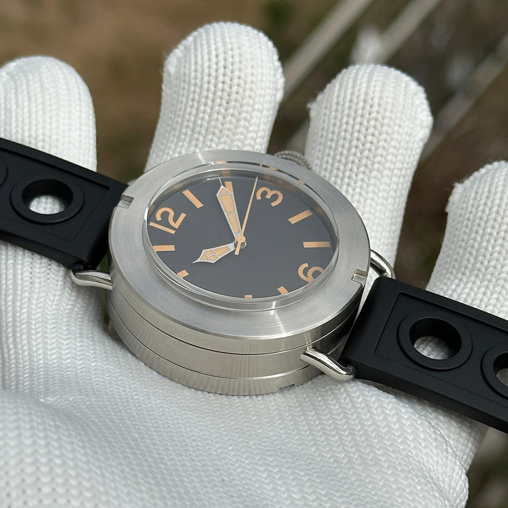 Steeldive SD1912 angled view highlighting domed sapphire crystal, brushed 47mm case and black rubber strap