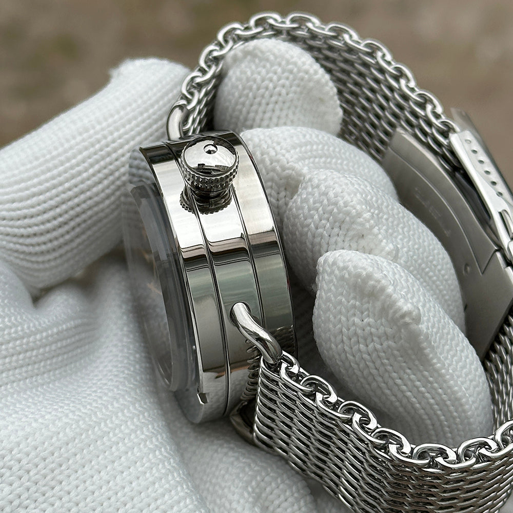 Steeldive SD1912 polished case crown detail with signed screw-down crown and mesh bracelet