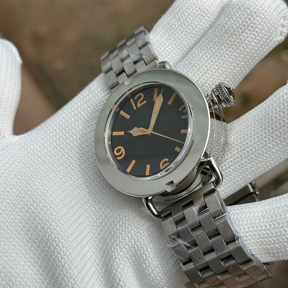 Steeldive SD1912 polished 47mm watch on oyster steel bracelet, dynamic three-quarter angle on glove