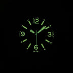 Steeldive SD1912 dive watch lume shot showing bright green C3 lume on Arabic numerals and hands in the dark