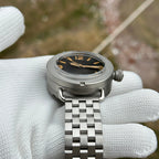 Steeldive SD1912 47mm sandblast diver three-quarter angle with black dial on five-link steel bracelet
