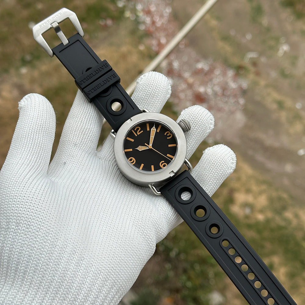 Steeldive SD1912 47mm sandblast diver on black holey rubber strap with steel buckle, angled view