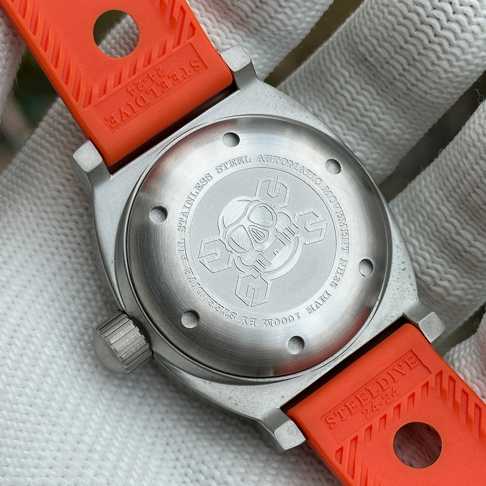Steeldive SD1920 1000m diver caseback macro with engraved scuba motif on orange rubber strap