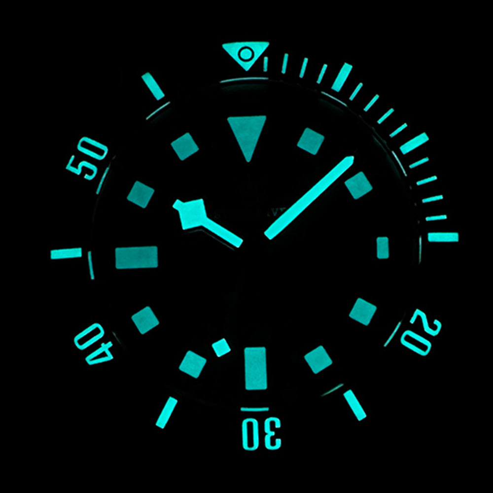 STEELDIVE SD1925 lume shot with hands, markers and bezel glowing aqua in the dark