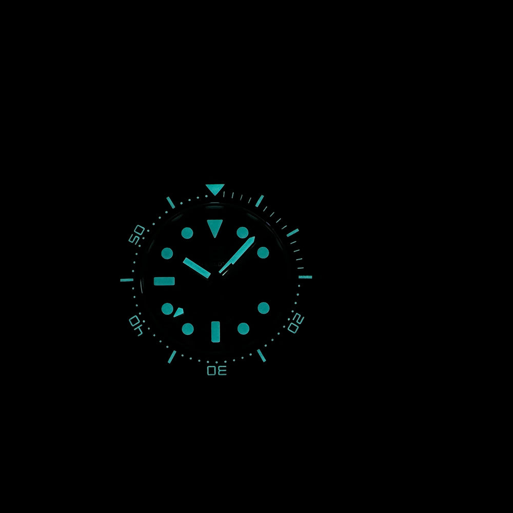 Steeldive SD1929 dive watch lume shot, cyan-green BGW9 luminescent indices and hands glowing in the dark