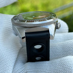 Steeldive SD1929 dive watch outdoor lifestyle shot with sapphire crystal reflecting green foliage tones
