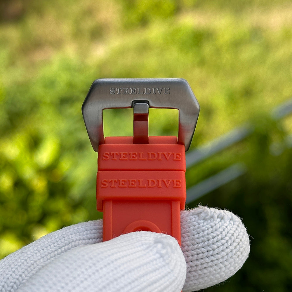 Steeldive SD1929 orange rubber strap with signed steel pin buckle and embossed Steeldive logo keepers