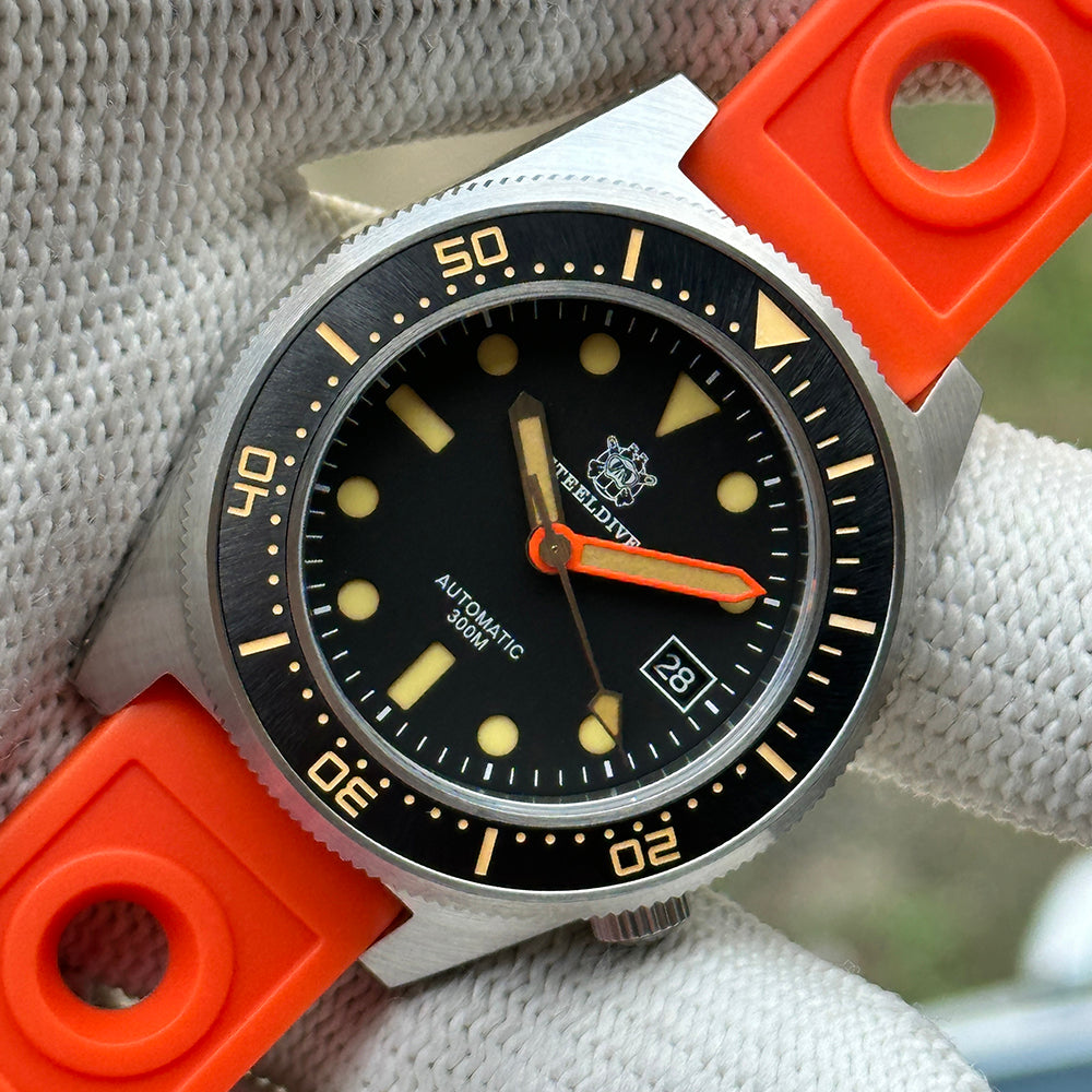 STEELDIVE SD1929V black dial dive watch on an orange rally-style rubber strap
