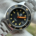 STEELDIVE SD1929V black dial with vintage cream lume and orange minute hand on a steel bracelet