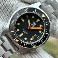 STEELDIVE SD1929V black dial with vintage cream lume and orange minute hand on a steel bracelet
