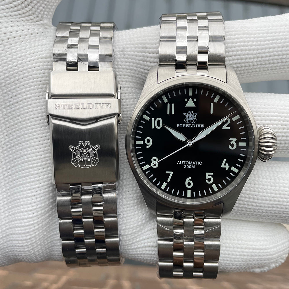 Steeldive SD1930 pilot watch with steel bracelet detached, clasp engraved with diver logo, front comparison
