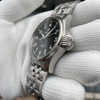 Steeldive SD1930 pilot watch case profile with prominent fluted crown and steel jubilee bracelet side angle