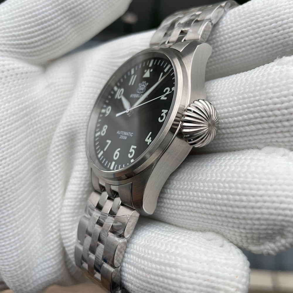 Steeldive SD1930 pilot watch case profile with prominent fluted crown and steel jubilee bracelet side angle