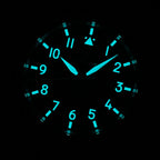 Steeldive SD1930 pilot dial glowing blue-green Super-LumiNova in the dark, lume shot of numerals and hands