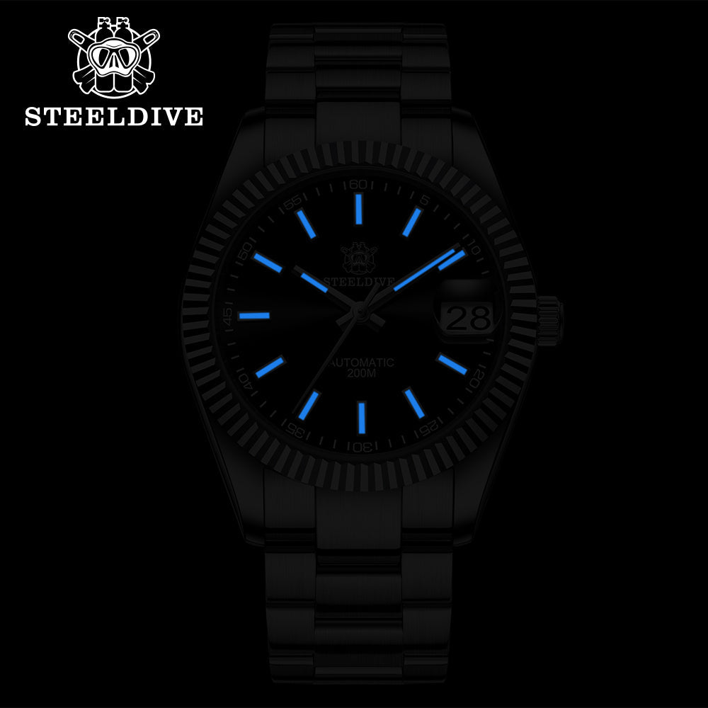 Steeldive SD1933 dive watch low-light lume shot showing blue glowing indices and hands