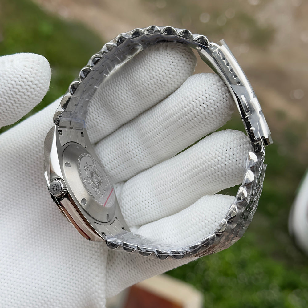 Steeldive SD1933 jubilee bracelet clasp and folded steel deployant detail in gloved hand