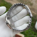 Steeldive SD1933 jubilee bracelet clasp and folded steel deployant detail in gloved hand