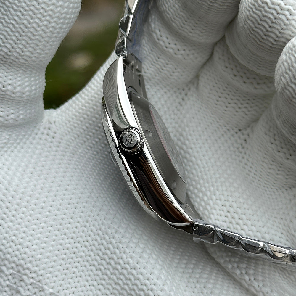 Steeldive SD1933 side profile macro showing signed steel crown and polished case flank