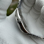 Steeldive SD1933 side profile macro showing signed steel crown and polished case flank