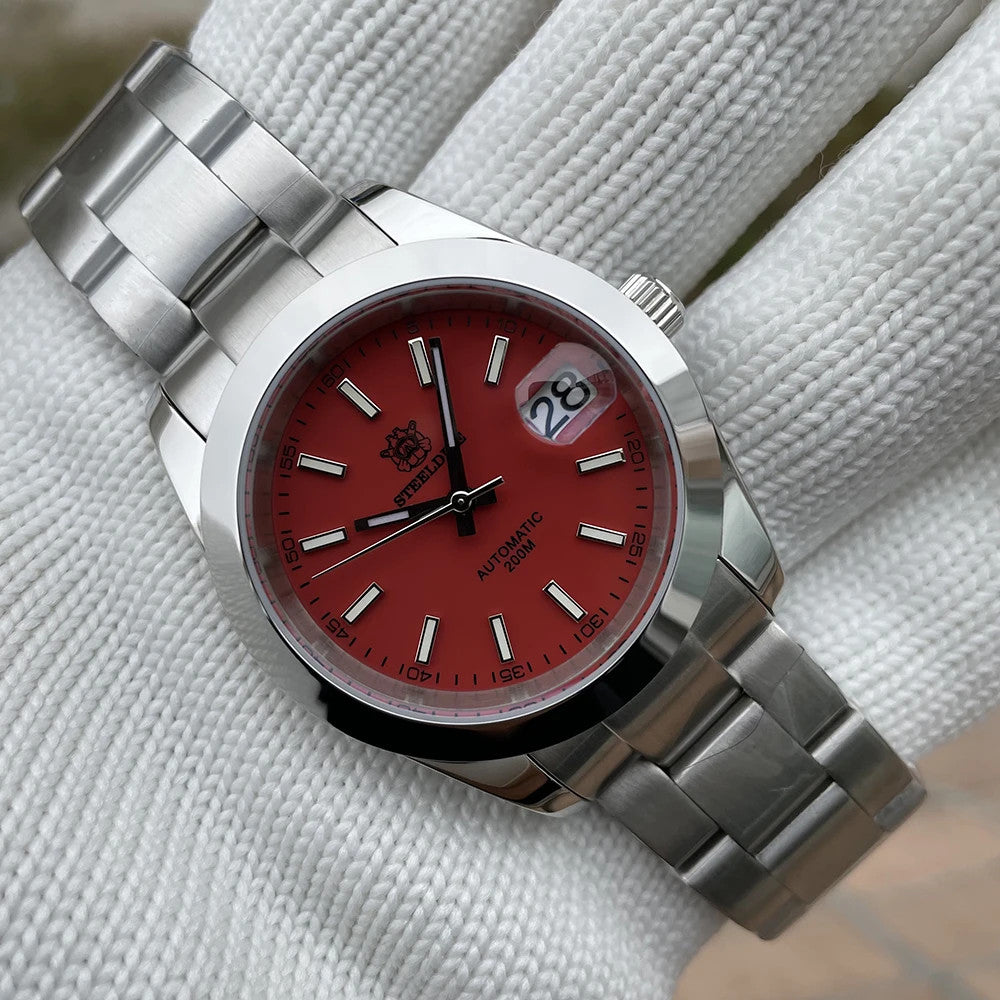 Steeldive SD1934 dive watch with black dial and oyster steel bracelet on white wrist roll