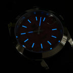 Steeldive SD1934 dive watch lume shot with blue glowing indices and hands in the dark