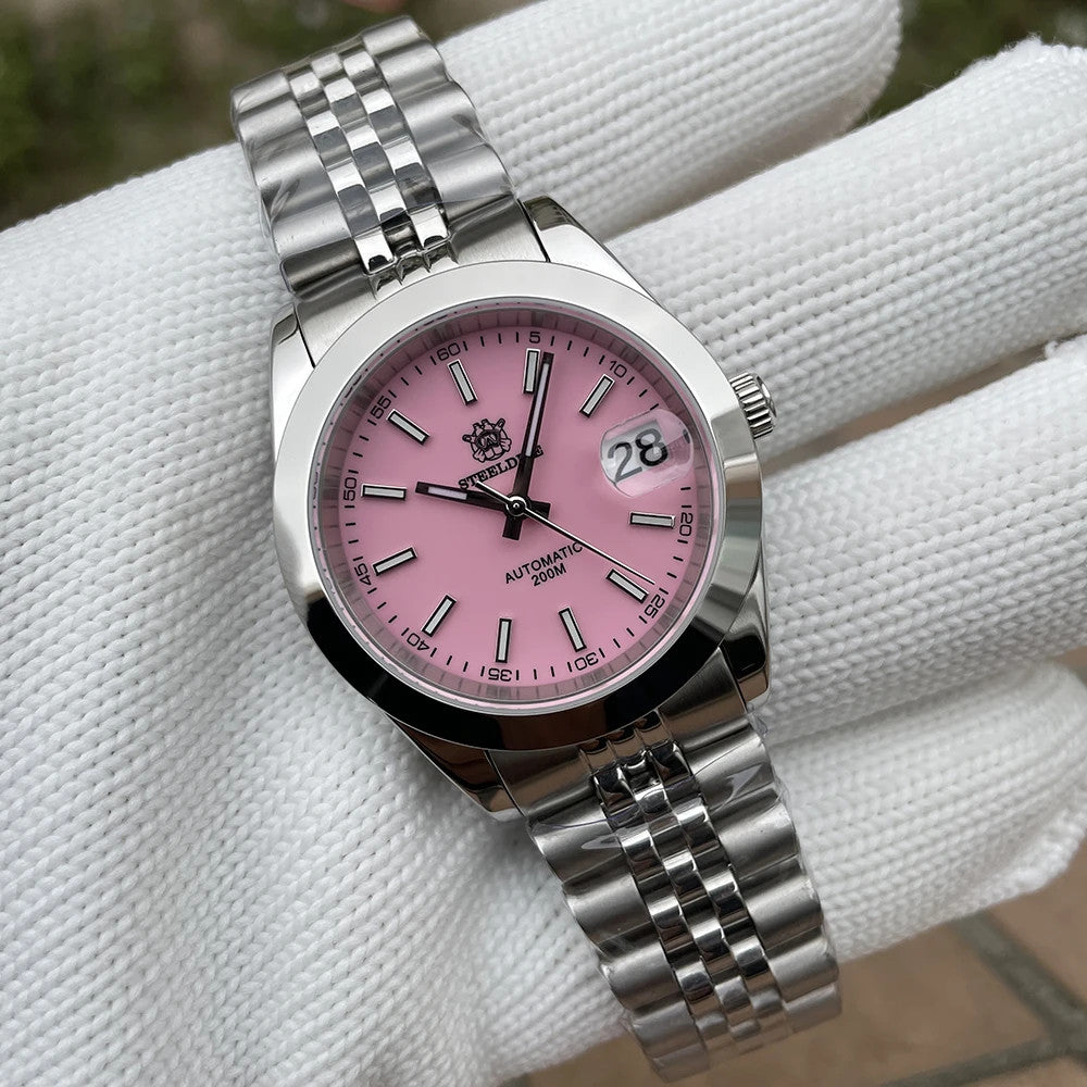 Steeldive SD1934 dive watch with pink dial and jubilee bracelet on gloved wrist roll