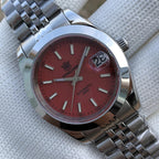 Steeldive SD1934 dive watch with red dial and jubilee bracelet angled on wrist roll