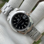 Steeldive SD1934 dive watch with red dial and red perforated rubber rally strap on wrist roll