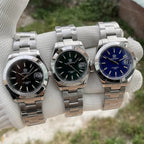 Steeldive SD1934 dive watch trio comparison with black, green and blue dials on jubilee bracelets
