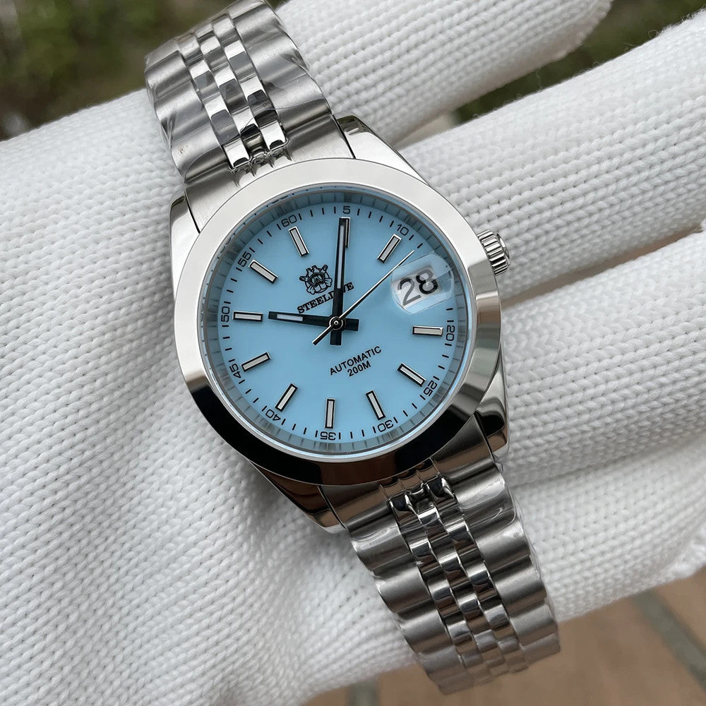Steeldive SD1934 dive watch with turquoise dial and jubilee bracelet on wrist roll