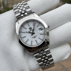 Steeldive SD1934 dive watch with white dial and jubilee bracelet angled on wrist roll